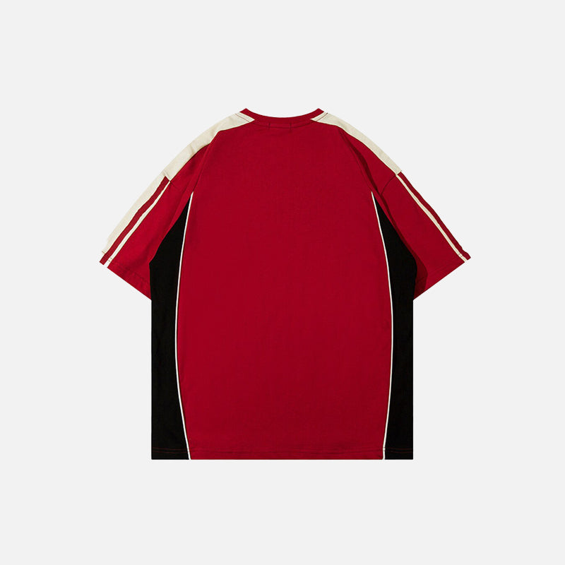 back view of the red AW Spiky Head T-shirt in a gray background