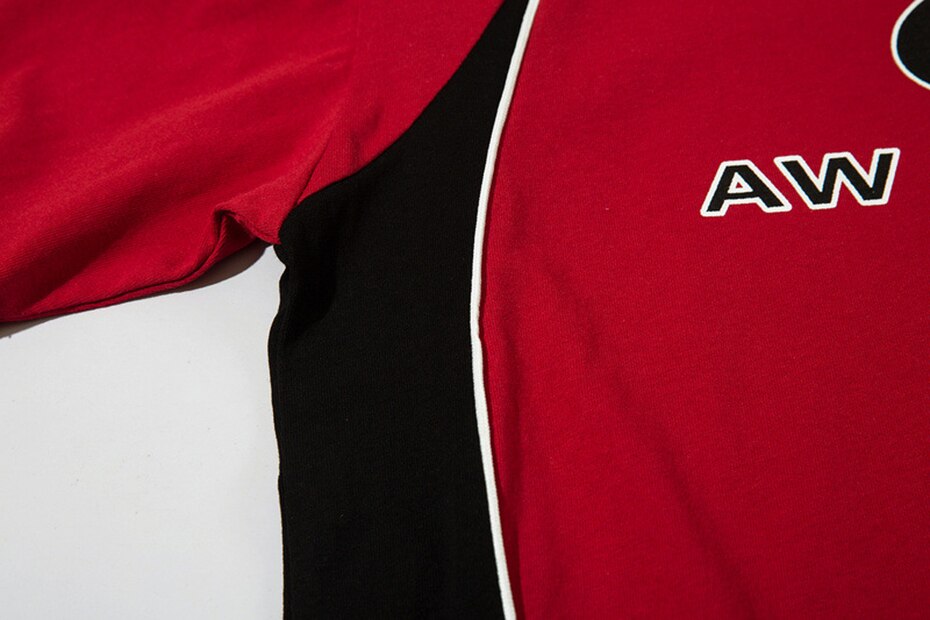 Details of the red AW Spiky Head T-shirt